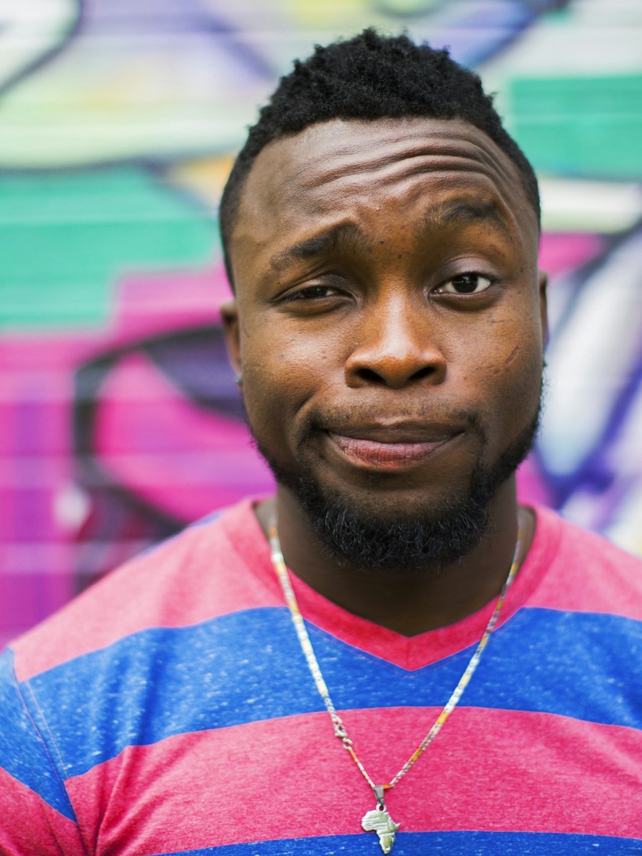 A man looking toward the camera with a slight smile.